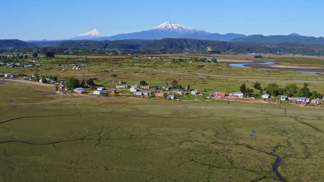 Aerial view of the surroundings of the community of Chamiza in the city of Puerto Montt on a sunny day with few clouds