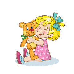 Little girl sitting on the floor with a favorite teddy bear in her arms. Isolated on a white background.