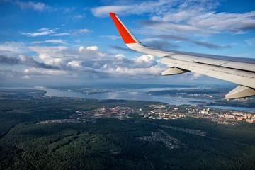 wingwing of an airplane flying above clouds of an airplane flying above clouds