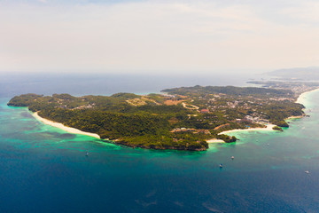 Seascape with island of Boracay, Philippines, top view. A large island with urban buildings and...