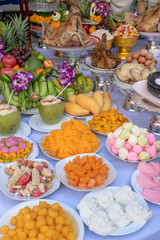 Sacrificial offering food for pray to god and memorial to ancestor, Bangkok, Thailand. Traditional offerings to gods with food, vegetable and fruit for the gods of Thai culture