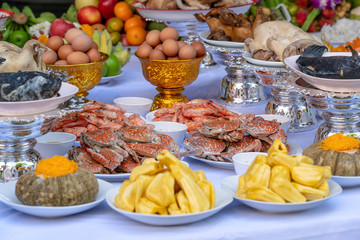 Sacrificial offering food for pray to god and memorial to ancestor, Bangkok, Thailand. Traditional offerings to gods with food, vegetable and fruit for the gods of Thai culture