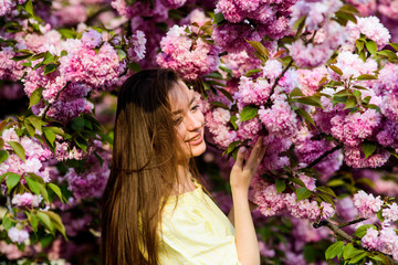 Natural cosmetics for skin. Floral paradise. Floral shop. Girl in cherry blossom flower. Sakura tree blooming. Soft and tender. Gorgeous flower and female beauty. Woman in spring flower bloom