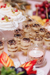 sweet festive buffet, fruit, caps, macaroni and lots of sweets