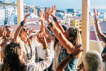 Group of happy young people caucasian women with terndy fashion clothes celebrate together with a...