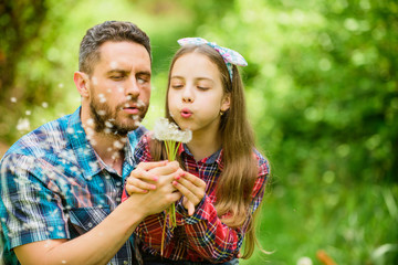 Obraz premium daughter and father love dandelion flower. family summer farm. spring village country. little girl and happy man dad. earth day. ecology. Happy family day. Tender moment