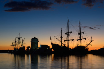 Fototapeta na wymiar silhouette of ship at sunset