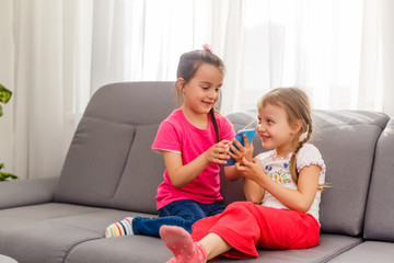 Online stream vlog channel. Sisters take funny photo for social network account. Leisure and fun....