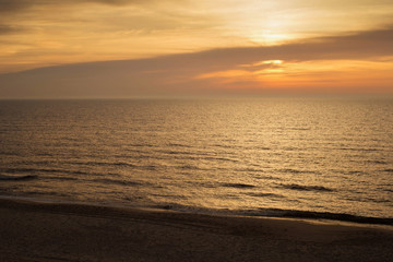 Fototapeta premium Beautiful sunset seascape with calm water.