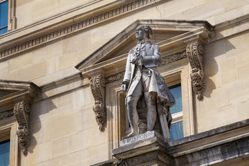 Georges-Louis Leclerc, Comte de Buffon (1707-1788) statue on the facade of the Louvre Palace, Paris, France. He was a French naturalist, mathematician, cosmologist, and encyclopediste.