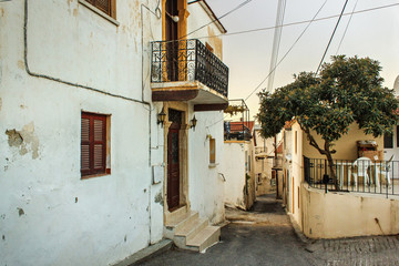 Fototapeta na wymiar One of the typical old narrow streets in Bellapais village near Kyrenia (Girne) town in Northern Cyprus.