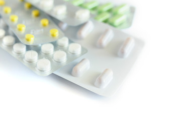 Different medicines: tablets, pills in blister pack isolated on white background