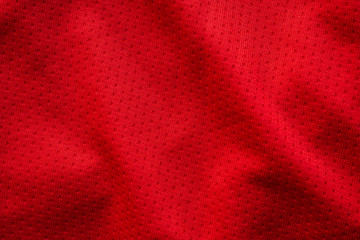 Red fabric sport clothing football jersey with air mesh texture background