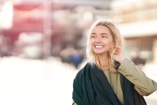 Cheerful young woman in the city