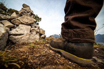 man foot boot in mountain - time to hiking and disconnect concept