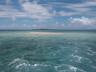 Naklejka na ściany i meble Okinawa,Japan-May 31, 2019: Barasu island, formed with pieces of coral: a very very small desolate island located north of Iriomote island.