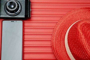Retro camera and smartphone on red background. Blogging or blogger concept.