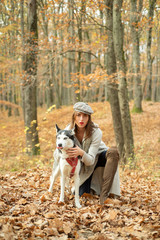 Girl pretty stylish woman walking with husky dog autumn forest. Pedigree dog concept. Best friends. Unconditional love. Girl enjoy walk with husky dog. Siberian husky favorite pet. Animal husbandry