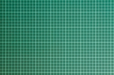 white checkered pattern on a green cutting mat background close up. rough surface texture