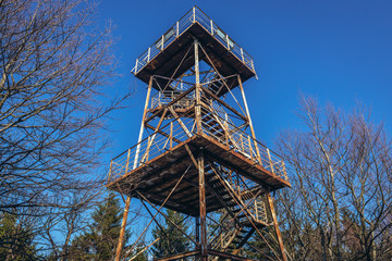 Old rusty observation tower on the peak of Mount Kalenica in Owl Mountains Landscape Park, protected area in Lower Silesia Province of Poland