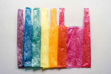 Plastic bags stacked in rainbow colors. Ecology reminder. Consumer society. Conceptual image.