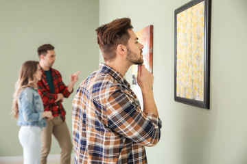 People at exhibition in modern art gallery