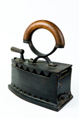 Vintage ironing tool, traditional steel coal iron.