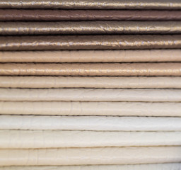 Obraz premium Catalog of multicolored imitation leather from matting fabric texture background, leatherette fabric texture. Industry background. 