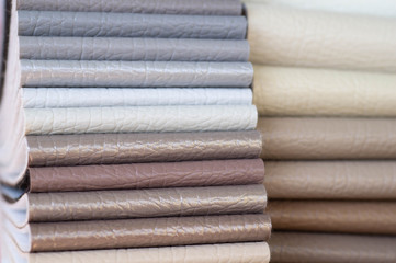 Catalog of multicolored imitation leather from matting fabric texture background, leatherette fabric texture. Industry background. 