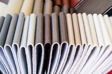 Catalog of multicolored imitation leather from matting fabric texture background, leatherette fabric texture. Industry background. 