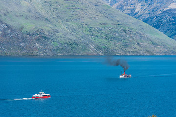 Steamboat sails on lake Wakatipu, Queenstown, New Zealand. Copy space for text.