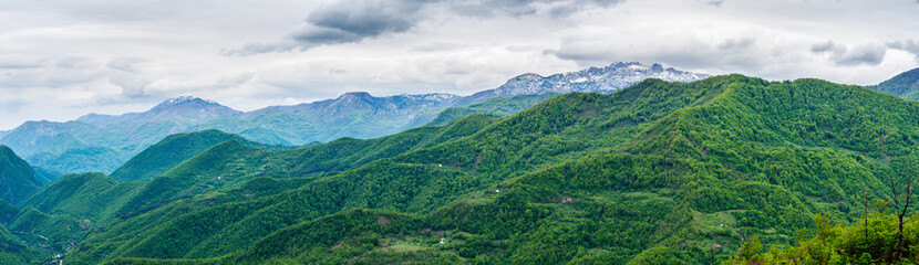 Montenegro, XXL panorama of green paradise nature landscape of forest and snow covered mountains of...