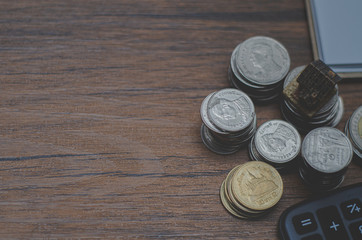 On the desk, there is a silver coin placed on it.