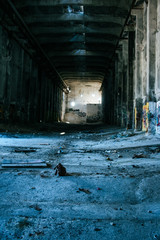 Dark, empty and gritty abandoned hall of a destructed factory