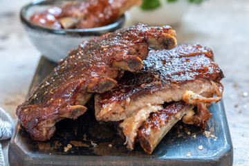 Grilled and smoked pork ribs with barbeque sauce