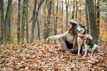 Girl enjoy walk with husky dog. Siberian husky favorite pet. Animal husbandry. Girl pretty stylish...