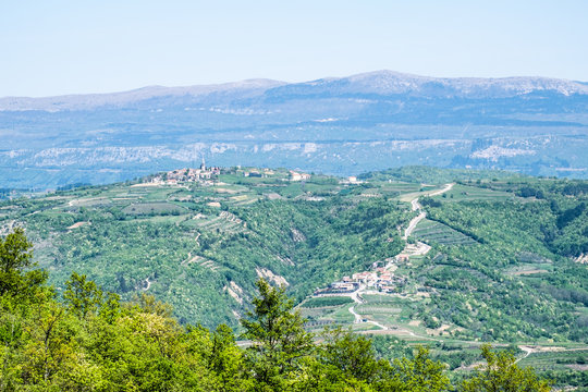 Villages Vrh and Paladini in Istria, Croatia with mountains Slavniksh
