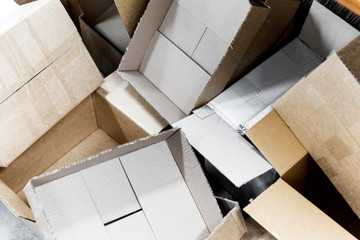Empty cardboard boxes stacked in a pile.