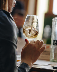 Glass of rose and white wine seen in close hand.