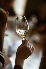 Glass of rose and white wine seen in close hand.