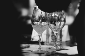 Glass of rose and white wine seen in close hand.