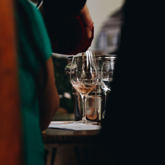 Glass of rose and white wine seen in close hand.