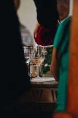 Glass of rose and white wine seen in close hand.