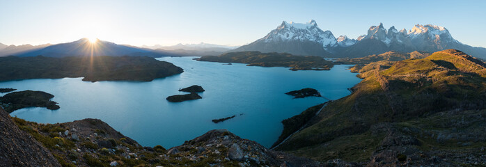 Panorama of Torres del Paine National Park with snow capped mountains (Cordillera Paine) and blue...
