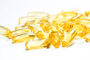 Fish oil capsule on isolated white background.