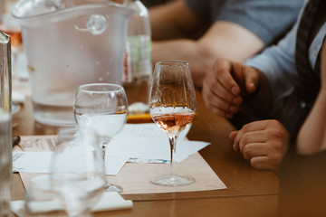 Obraz na płótnie Canvas Glass of rose and white wine seen in close hand.
