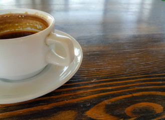a Cup of natural black coffee on a wooden table in a seaside cafe