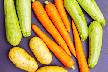 Fresh vegetables cooking black stone background