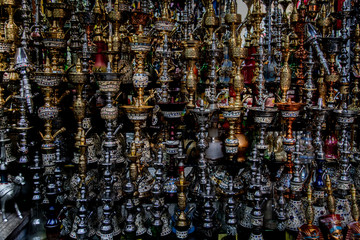 Shop owner presenting his hookahs in the streets of Cairo