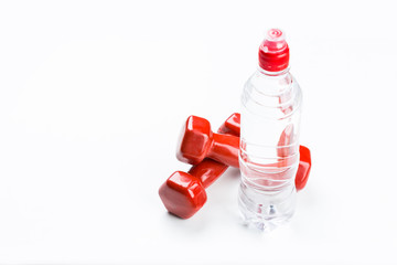 Fitness concept with dumbbells and water bottle